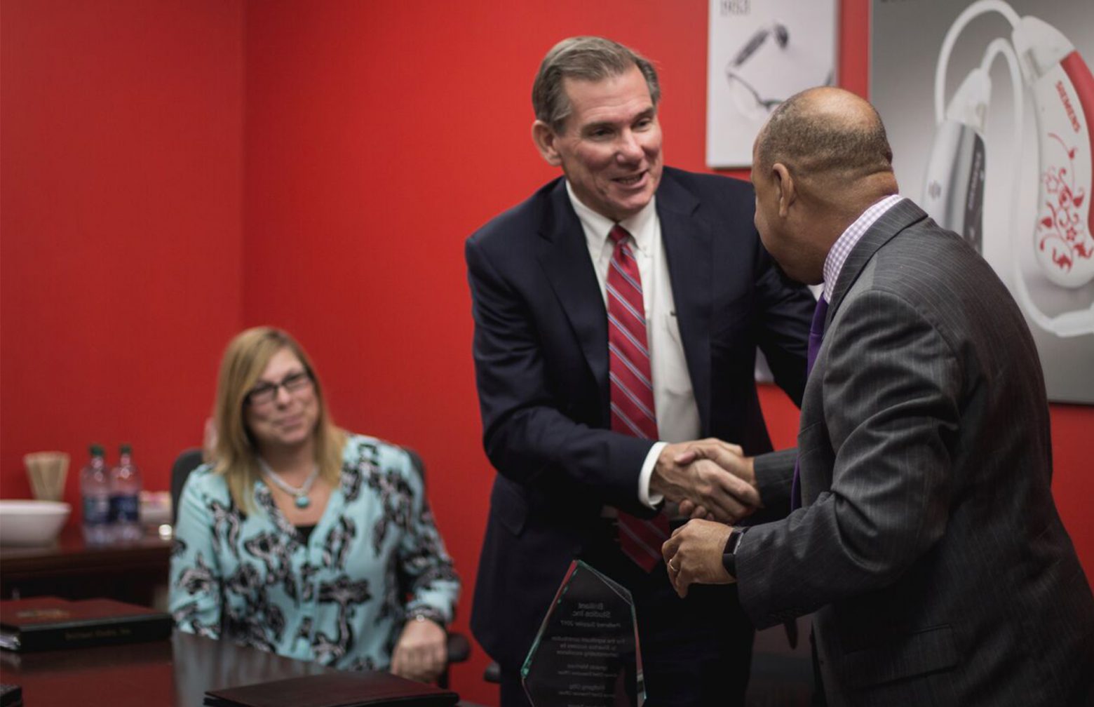 Two men shaking hands during the Supplier Award ceremony